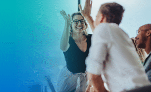 coworkers-in-office-giving-high-fives