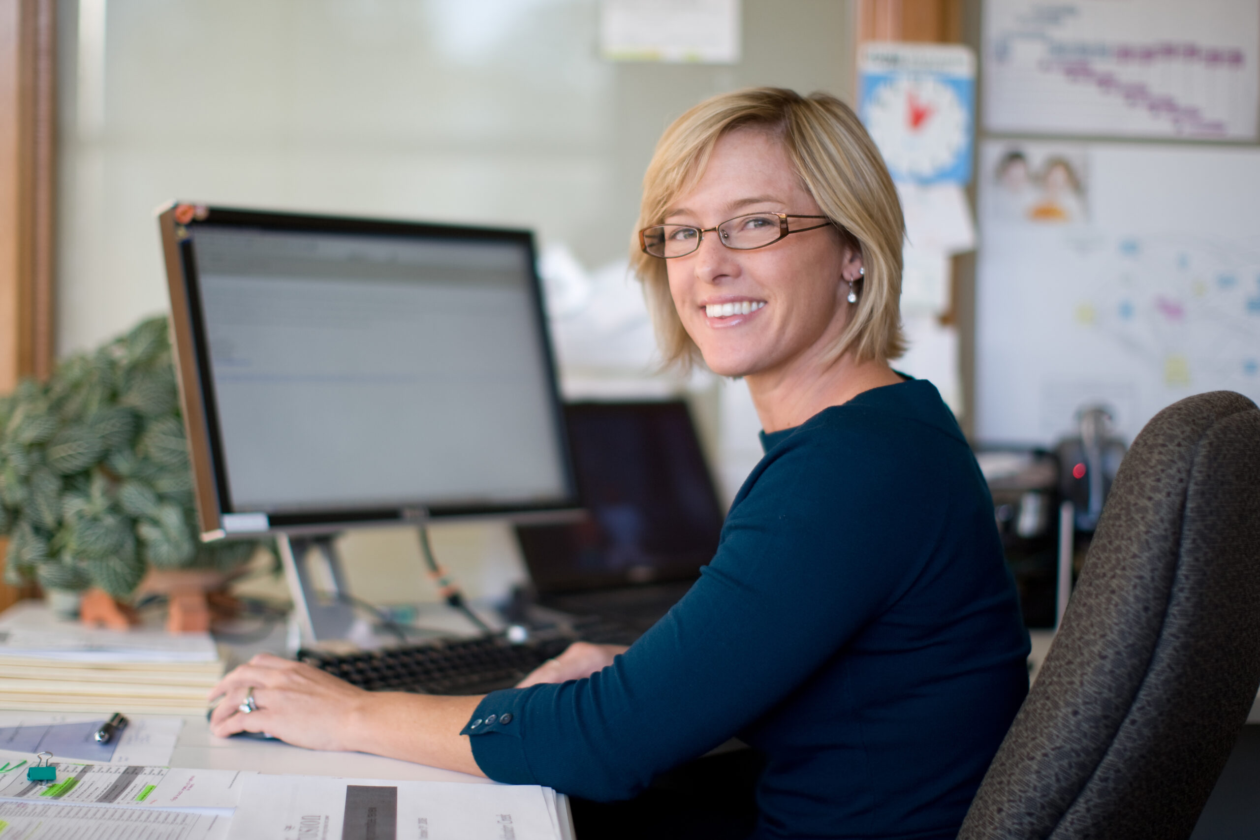 A school administrator reducing busywork by using Ravenna admissions and enrollment software